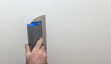 Material de enlucido